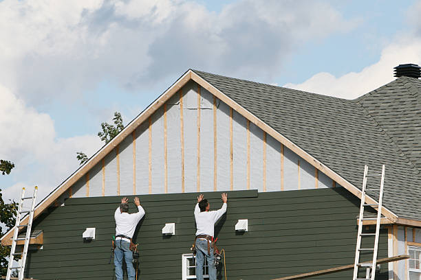Professional Emergency Siding Repair technician working in Queenstown, MD